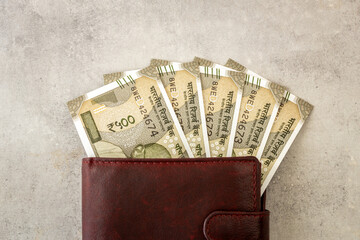 India money. Indian rupees, 500-rupee bills sticking out of a wallet. The currency is INR. Business and financial concept.
