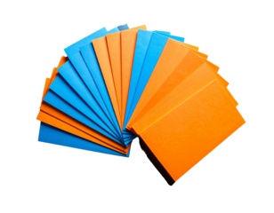  Top-Down View of Fanned Stack of Orange and Blue Flyers on Dark Background, Transparent PNG