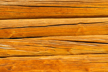 background in the form of a wall made of old wood. wood texture. wall made of old logs. natural wood background. aged logs. High quality photo