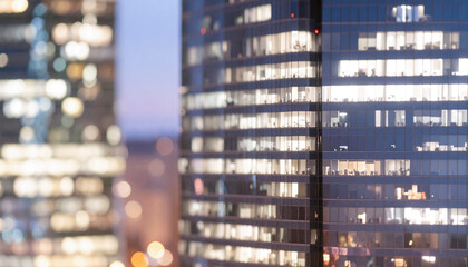 High-rise office towers with glowing floors at night — concept of productivity and global business, perfect for finance/tech ads and web headers