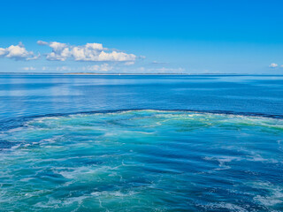 The Serene and Tranquil Ocean Waters Under the Bright and Clear Blue Skies Above