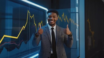 Confident businessman in a suit enthusiastically gives thumbs up in front of a digital graph display, showcasing success and positive business outcomes