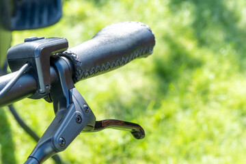 Close-up of bicycle brake on handlebar, detail of modern bike technology and safety