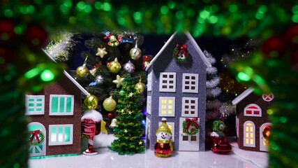 The Christmas wreath features a Christmas village with snowmen and Christmas trees next to houses
