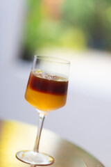 Elegant crystal glasses of red and white wine sit on a restaurant table, ready for a celebration