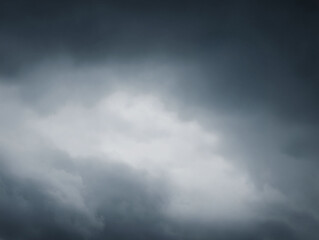 Brooding, dramatic sky filled with dark, ominous clouds. Perfect for conveying moodiness, tension, or the power of nature. Use for backgrounds, metaphors, or weather themes.