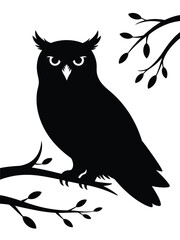 Silhouette of a great horned owl perched on a bare tree branch