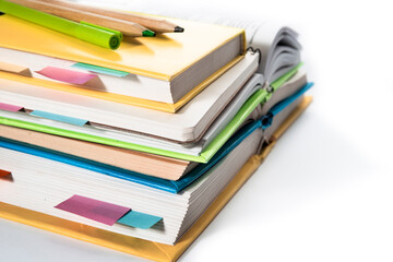 Notepad, notebooks, textbooks and books with bookmarks and stickers. The concept of diligent study
