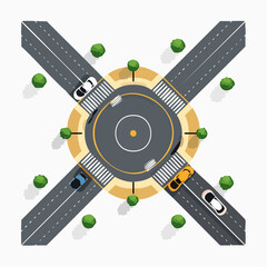 Overhead view of a roundabout intersection with cars and pedestrian crossings.