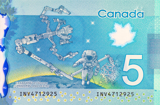 5 Dollars Canada, 2013 with the image of Dextre and canadarm2. International Space Station. Polymer money of Canada. - Powered by Adobe