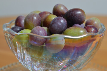 A photograph of ripe olives taken indoors