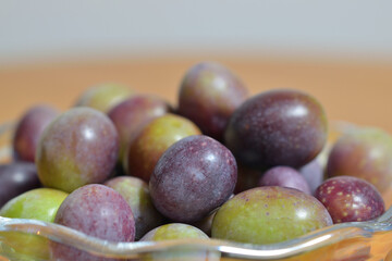 A photograph of ripe olives taken indoors