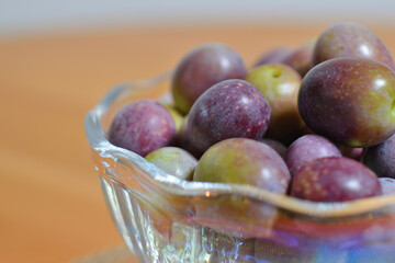 A photograph of ripe olives taken indoors