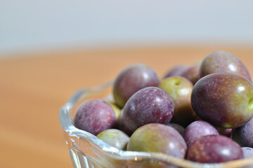 A photograph of ripe olives taken indoors