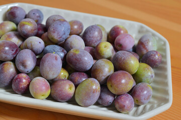 A photograph of ripe olives taken indoors