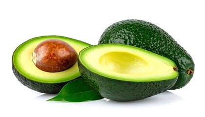 Two halves of an avocado, one whole, with leaves