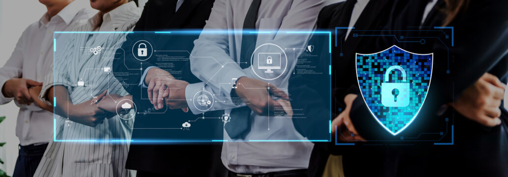 A diverse business team stands shoulder to shoulder, highlighting unity and collaboration, with modern digital security icons representing cybersecurity in the workplace. Trope
