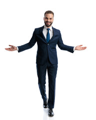 charming mature businessman opening arms and smiling