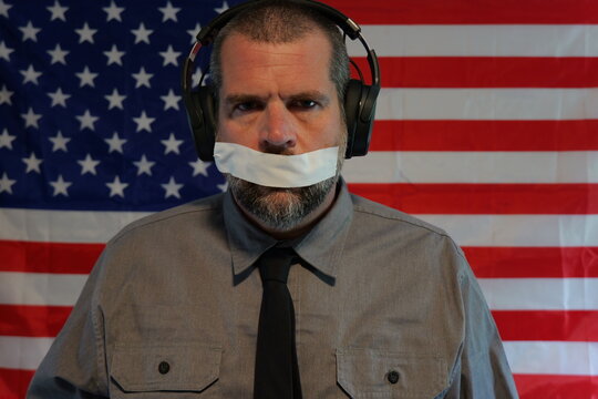 American Censorship Concept - Male Journalist or Politician - See no evil, Speak no evil, Hear no evil idea - Distracted Citizens