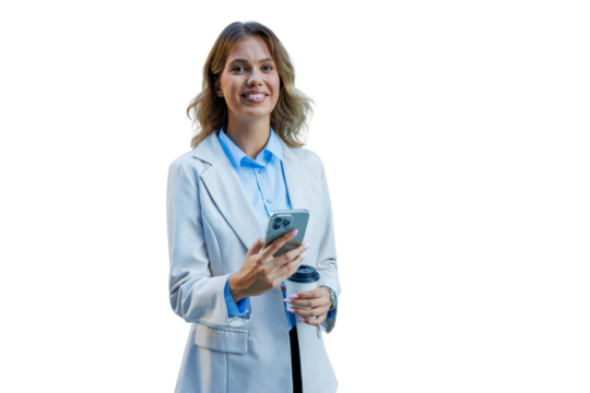 Professional young businesswoman smiling, holding mobile phone and coffee cup, checking social media or messages