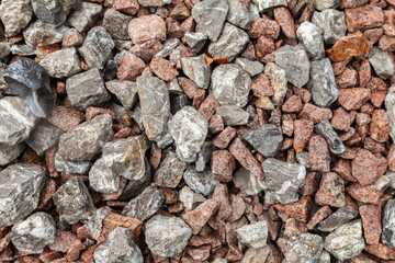 Pile of rocks with some of them being gray and some of them being red