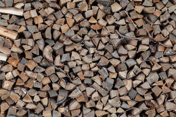 Stock of cut firewood background close up full frame