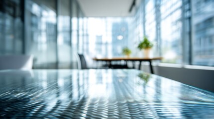 Fototapeta premium Glass table surface in contemporary office workspace. Blurred background. Professional business environment