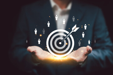 Business targeting objective of Customer Connection concept. Businessman holding virtual dart...