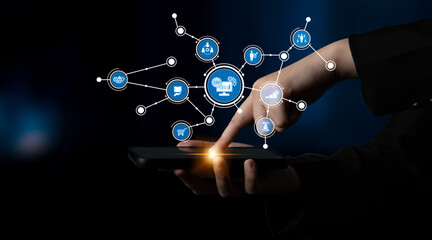 A hand interacting with a smartphone displaying various interconnected icons, representing the digital transformation and innovative technology across different sectors. Tessel