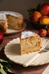 Slice of homemade apple cake with cinnamon, wooden background, lifestyle moody food photo