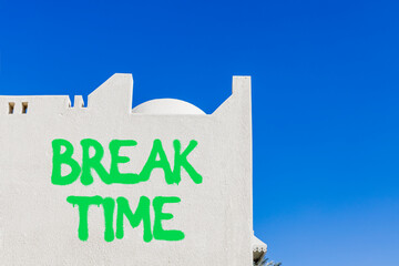 Break time symbol. Concept word Break time on beautiful white wall. Beautiful blue sky background. Business break time concept. Copy space.