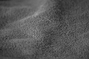 Dark Textile Fabric Texture. Close up view of dark textile material with soft woven surface.