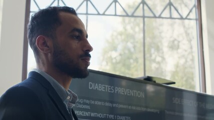 Young Middle Eastern endocrinologist doing presentation about new ways of diabetes prevention and treatment