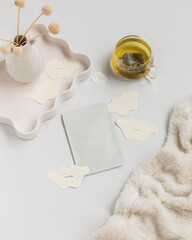 Packaging of mouth sleeping tape on white background styled with tea and blanket