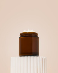 Whipped beef tallow moisturizer on platform with texture coming out of jar