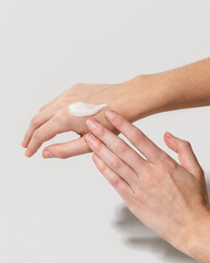 Woman using beef tallow moisturizer on hands