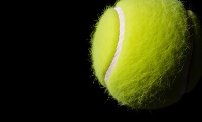 tennis ball on black background