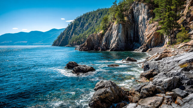 Serene coastal landscape with rocky shoreline and forested cliffs under a clear blue sky