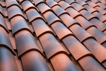 Terracotta clay roof tiles with barrel profile and row pattern