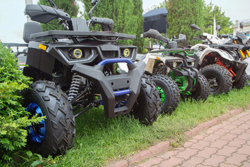New ATVs stand in a row on the exhibition site