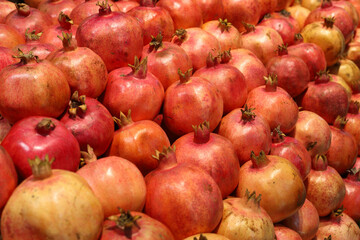 Pomegranates displayed on the counter. A beautiful background.