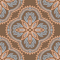 Seamless mandala pattern with floral and geometric elements in brown, orange and blue. Perfect for textiles, wallpaper, fabric, wrapping paper, boho design, surface decoration, digital backgrounds.