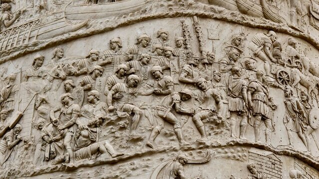 Rome, Italy - 11 January 2025. Trajan&rsquo;s Column depicts injured soldiers being aided and the Roman army advancing with standards and wagons during the Dacian campaign.