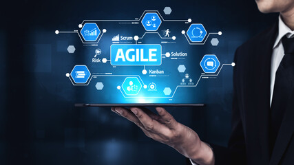 A business professional showcases Agile methodology through advanced visuals and technology in a modern corporate setting, highlighting efficiency and innovation. Tessel