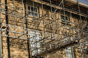 Scaffolding over old brick building during renovation