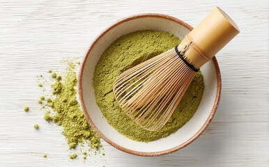 The wooden table holds a white bowl of matcha green tea powder, along with a bamboo whisk and a green towel, creating a morning mindfulness routine