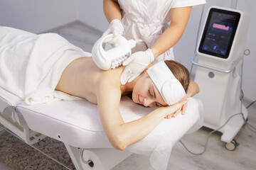 Compressive microvibration back massage with roller device in spa clinic