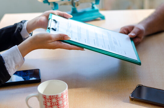 Document and man compensation paperwork, insurance, legal contract or lawyer consulting. Disability people, attorney or advocate in negotiation, policy advice or accident report closeup