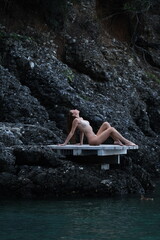 Fototapeta premium young woman relaxing on the sea beach. hot summer vacation