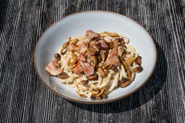 Plate of chicken and mushroom pasta. 